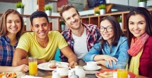 Diverse group of young adults eating brunch